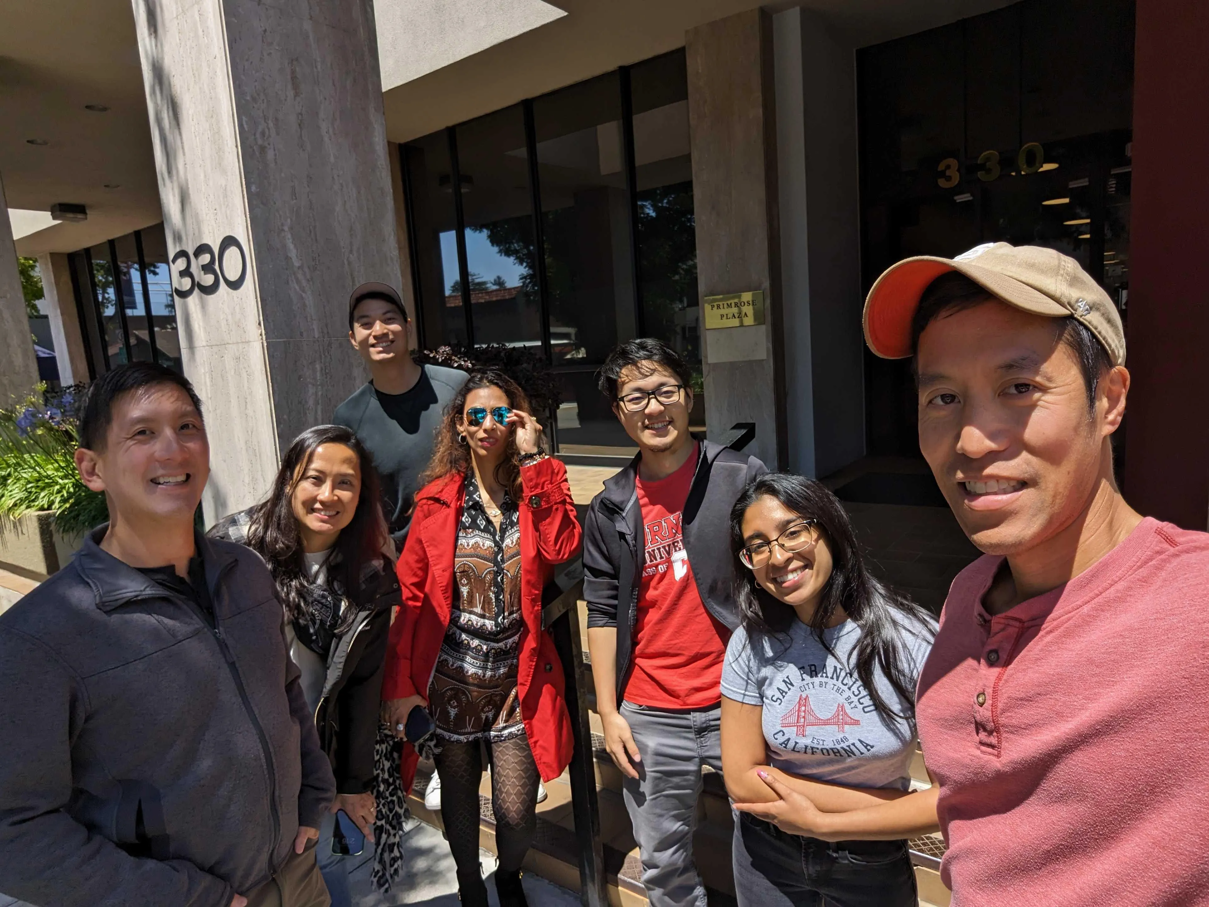 a group of Jampack staff standing in front of a restaurant